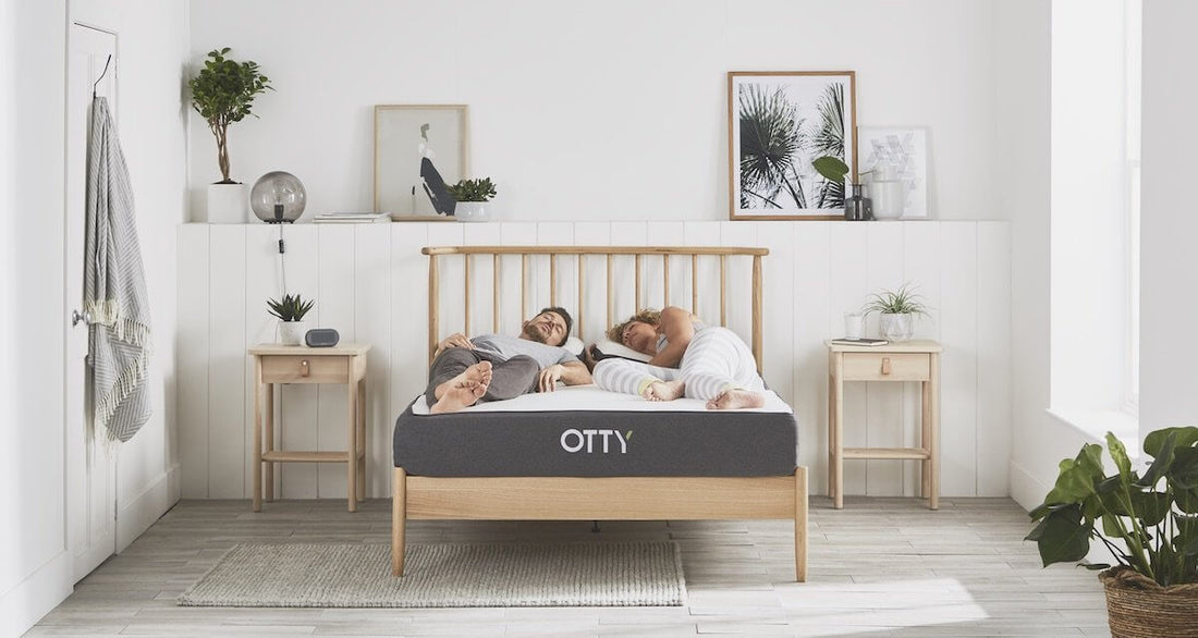 image of a couple on top of a hybrid mattress having a lovely sleep