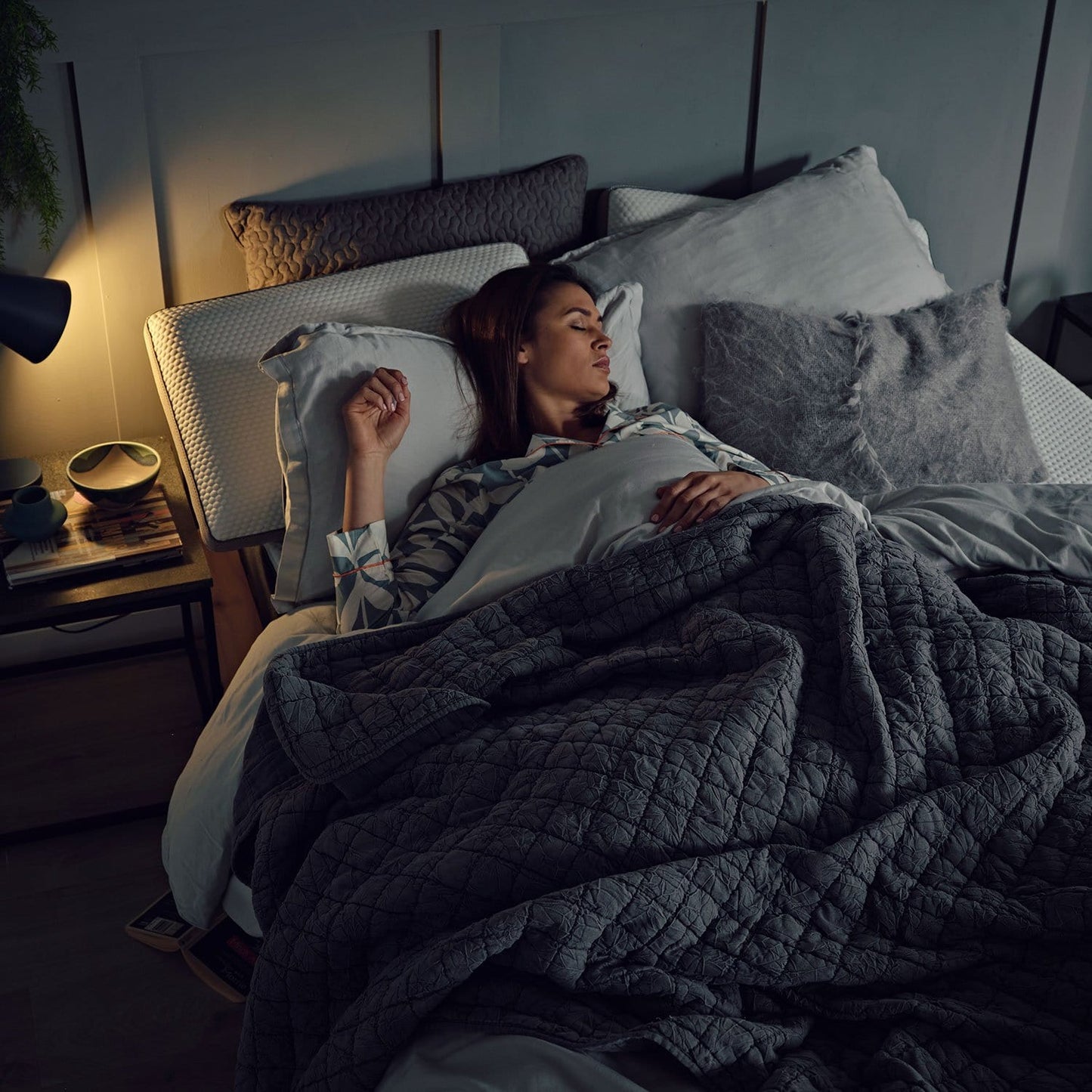 woman sleeping on an OTTY Aura Hybrid mattress with 1000 pocket springs.