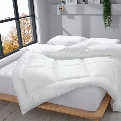 13.5 tog Tencel duvet on top of a hybrid mattress in a bedroom setting